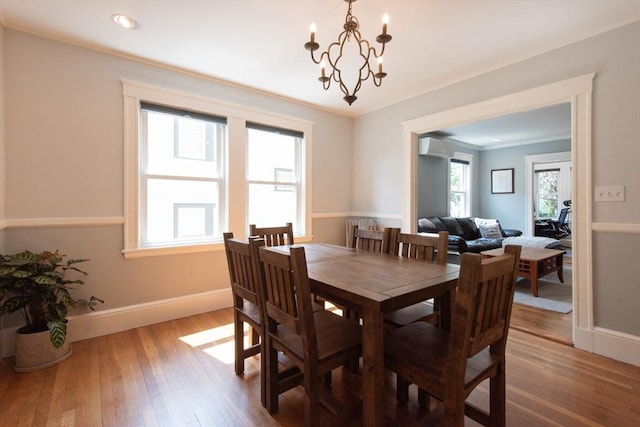 105 Fletcher St Unit 1, Boston, MA 02131 - dining area with wood finished floors, a wall mounted air conditioner, a chandelier, ornamental molding, and recessed lighting