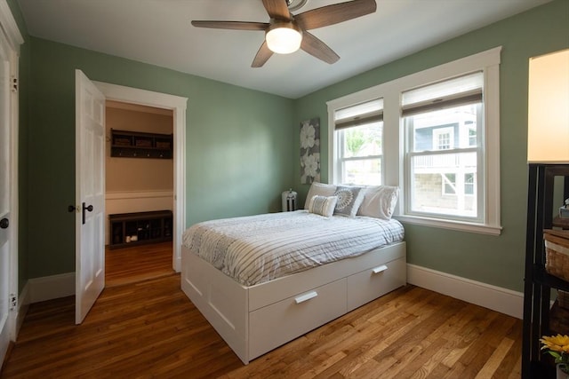 105 Fletcher St Unit 1, Boston, MA 02131 - bedroom featuring wood finished floors, ceiling fan, and radiator heating unit