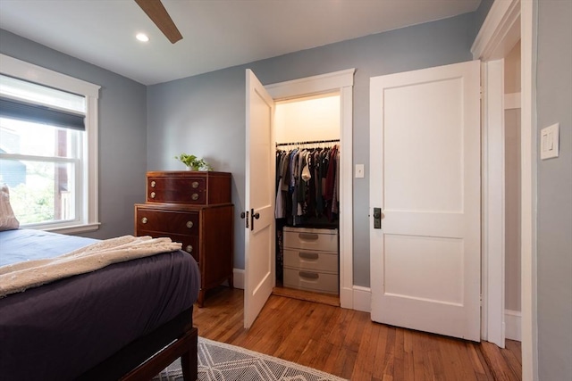 105 Fletcher St Unit 1, Boston, MA 02131 - bedroom with wood finished floors, a walk in closet, recessed lighting, a closet, and ceiling fan