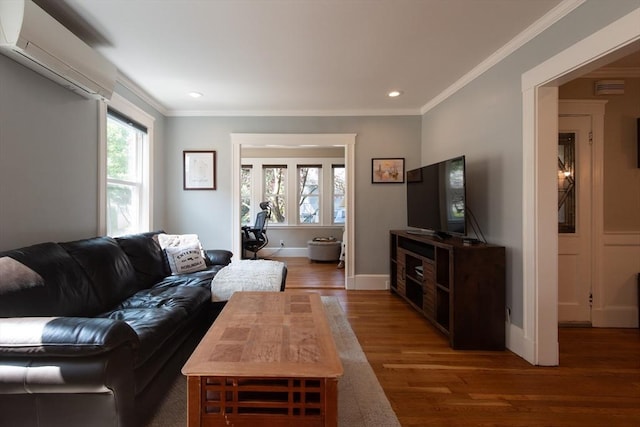 105 Fletcher St Unit 1, Boston, MA 02131 - living room with a wall mounted air conditioner, wood finished floors, ornamental molding, and recessed lighting