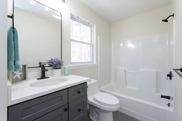 bathroom featuring tile patterned floors, shower / bath combination, toilet, and vanity