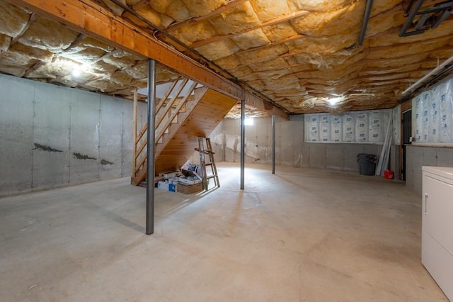 unfinished basement with washer / clothes dryer