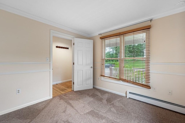 14 Midgley Ln, Worcester, MA 01604 - empty room with a baseboard radiator, ornamental molding, and carpet
