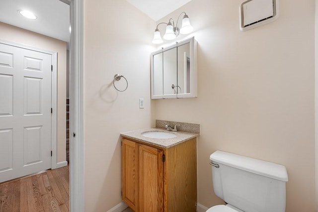 14 Midgley Ln, Worcester, MA 01604 - half bath with vanity and wood finished floors