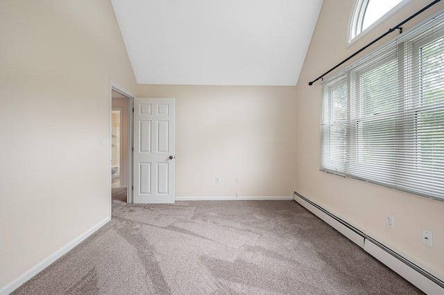 14 Midgley Ln, Worcester, MA 01604 - empty room featuring a baseboard radiator, lofted ceiling, carpet floors, and healthy amount of natural light