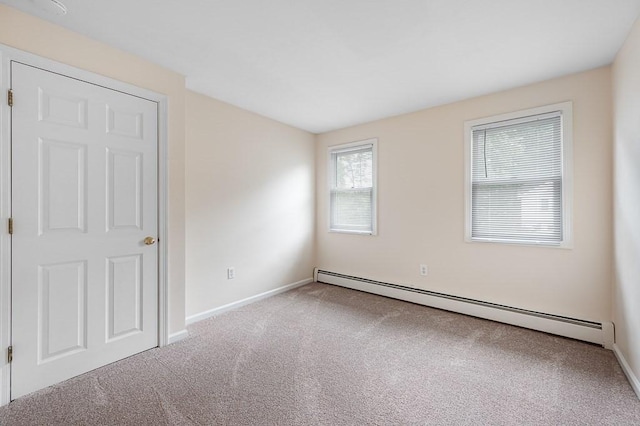 14 Midgley Ln, Worcester, MA 01604 - carpeted empty room with a baseboard radiator and baseboards