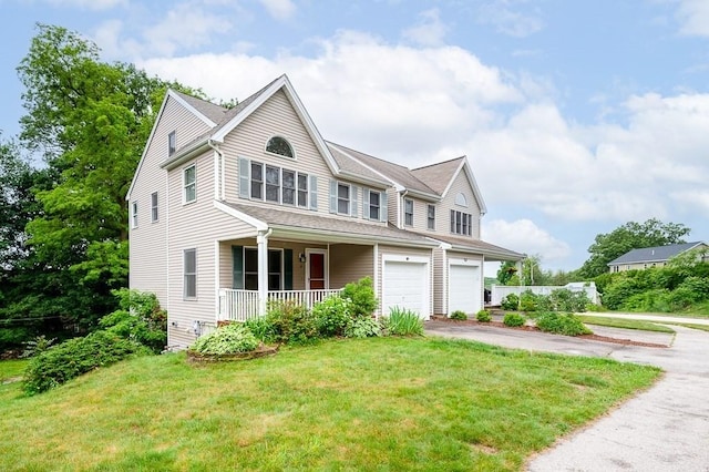 14 Midgley Ln, Worcester, MA 01604 - view of front facade with covered porch, a garage, driveway, and a front yard