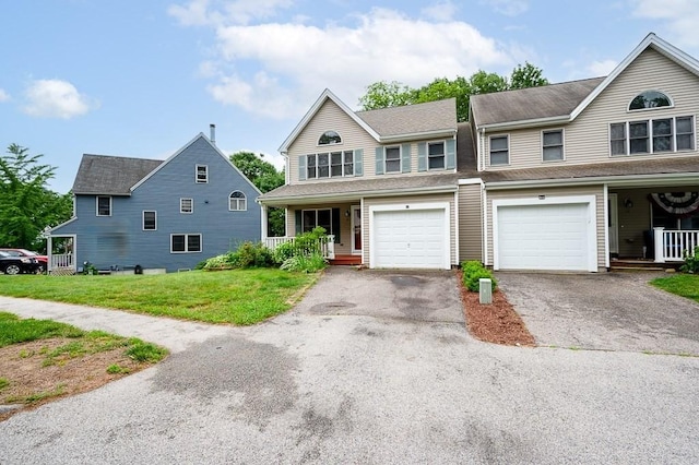 14 Midgley Ln, Worcester, MA 01604 - multi unit property featuring covered porch, driveway, a front yard, and an attached garage