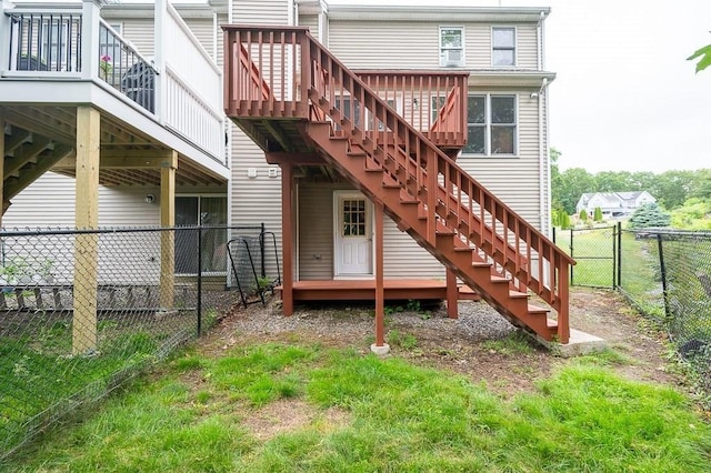 14 Midgley Ln, Worcester, MA 01604 - rear view of property featuring stairway, a wooden deck, a fenced backyard, and a gate