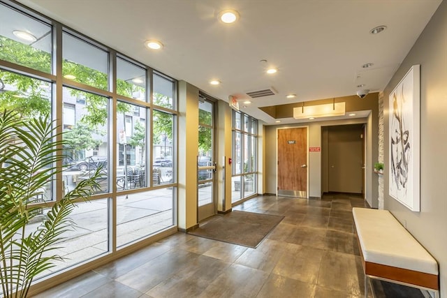 lobby featuring recessed lighting and expansive windows