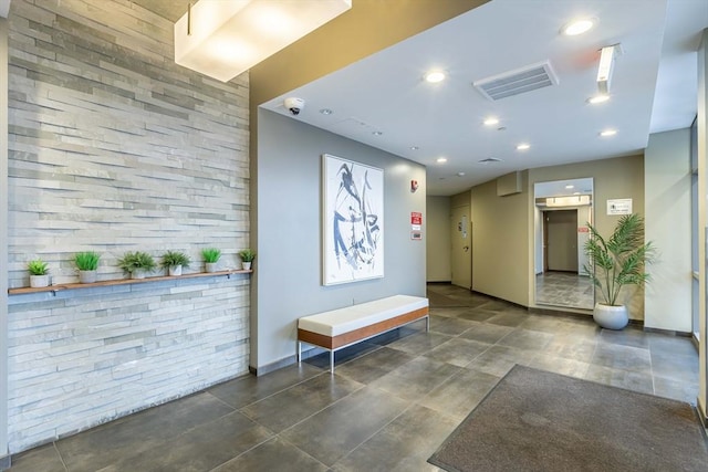 common area featuring a surveillance system and recessed lighting