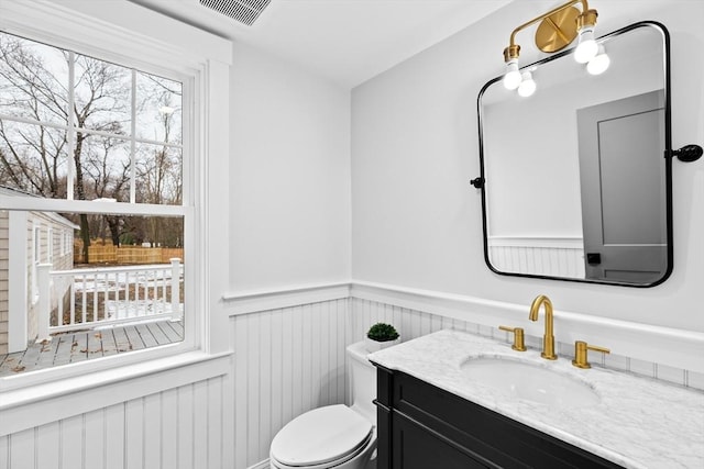 bathroom with vanity and toilet