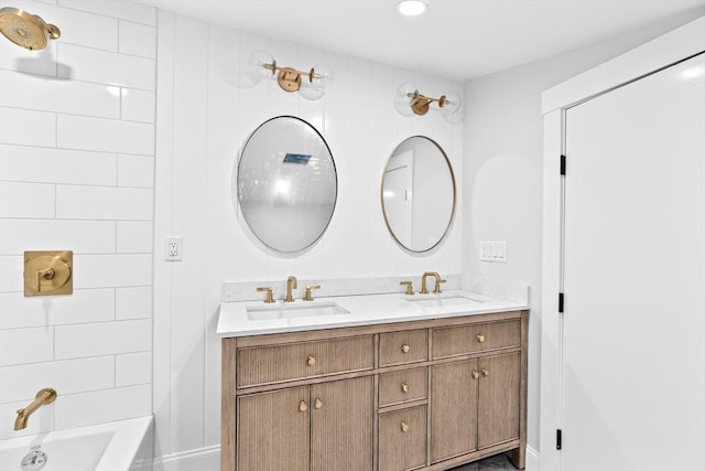 bathroom featuring vanity and tiled shower / bath combo