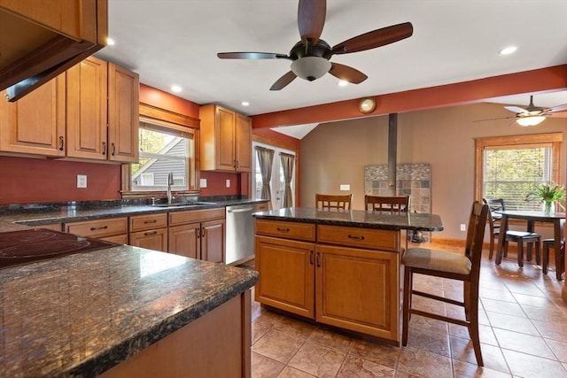 40 George St, Attleboro, MA 02703 - kitchen with dishwasher, a ceiling fan, a sink, a breakfast bar area, and a kitchen island