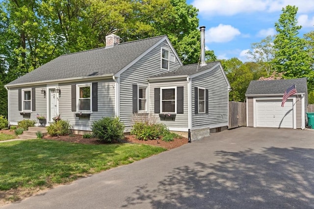 40 George St, Attleboro, MA 02703 - cape cod home with an outdoor structure, a chimney, driveway, a shingled roof, and a detached garage