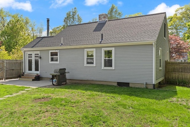 40 George St, Attleboro, MA 02703 - back of property featuring a chimney, a patio area, french doors, entry steps, and roof with shingles