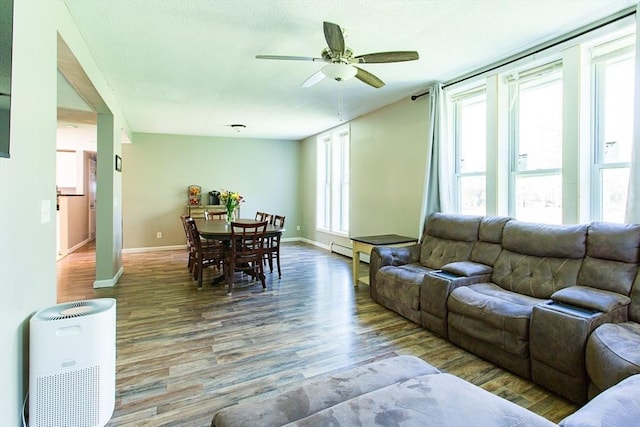 76 Kennedy Rd, West Brookfield, MA 01585 - living room featuring wood finished floors, ceiling fan, baseboards, and a baseboard heating unit