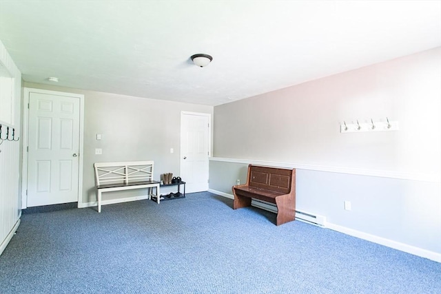 76 Kennedy Rd, West Brookfield, MA 01585 - living area featuring dark colored carpet, baseboards, and a baseboard heating unit