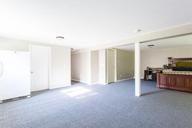 76 Kennedy Rd, West Brookfield, MA 01585 - finished below grade area featuring freestanding refrigerator, carpet, and baseboards