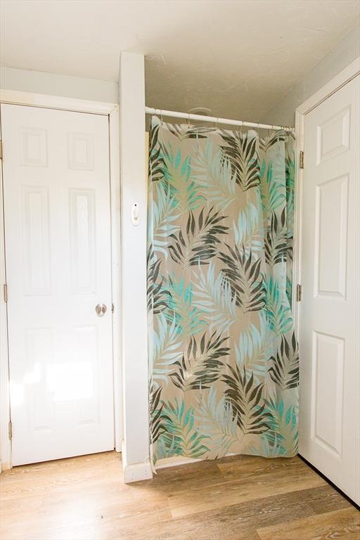 76 Kennedy Rd, West Brookfield, MA 01585 - bathroom featuring wood finished floors and a shower with curtain