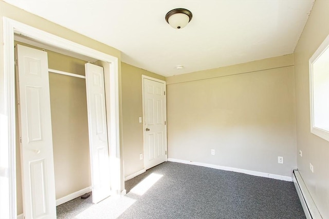 76 Kennedy Rd, West Brookfield, MA 01585 - unfurnished bedroom featuring a baseboard heating unit, carpet, and baseboards