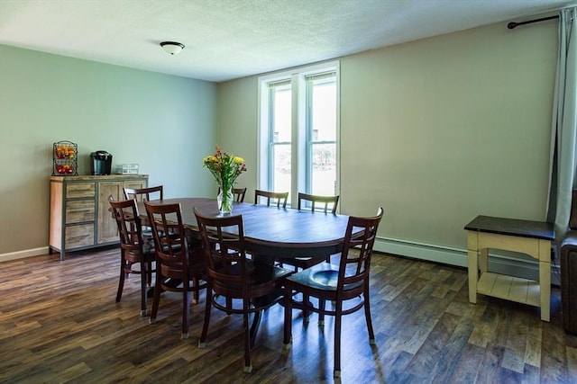 76 Kennedy Rd, West Brookfield, MA 01585 - dining area featuring dark wood finished floors, baseboard heating, baseboards, and a textured ceiling
