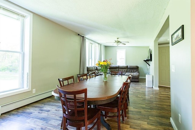 76 Kennedy Rd, West Brookfield, MA 01585 - dining room featuring ceiling fan, wood finished floors, a textured ceiling, a baseboard heating unit, and baseboards