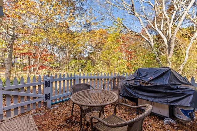 wooden terrace featuring grilling area