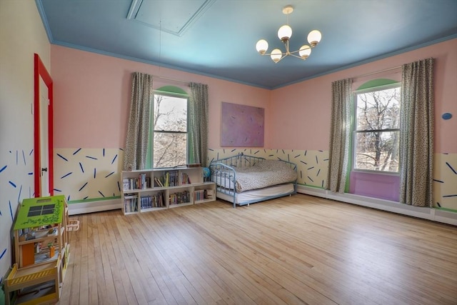 15 Estes, Amesbury, MA 01913 - bedroom featuring wood-type flooring, multiple windows, attic access, and crown molding