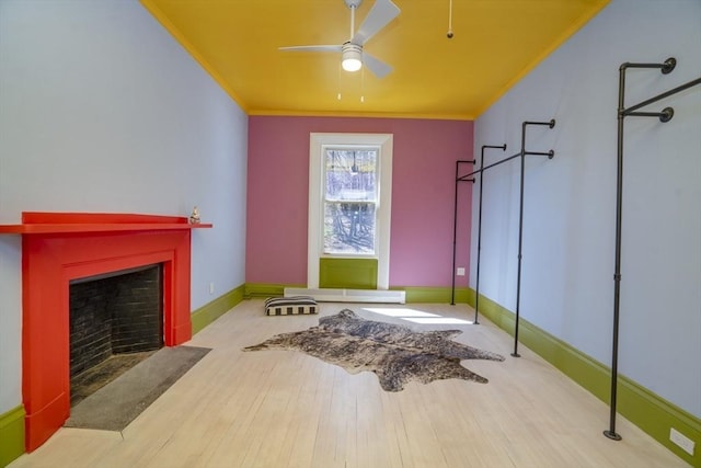 15 Estes, Amesbury, MA 01913 - interior space featuring ornamental molding, a ceiling fan, wood finished floors, and a fireplace with flush hearth