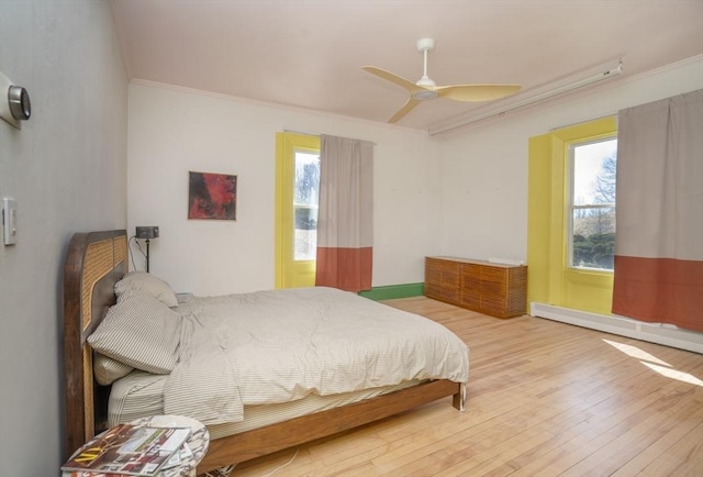 15 Estes, Amesbury, MA 01913 - bedroom with hardwood / wood-style floors, a baseboard heating unit, crown molding, and multiple windows