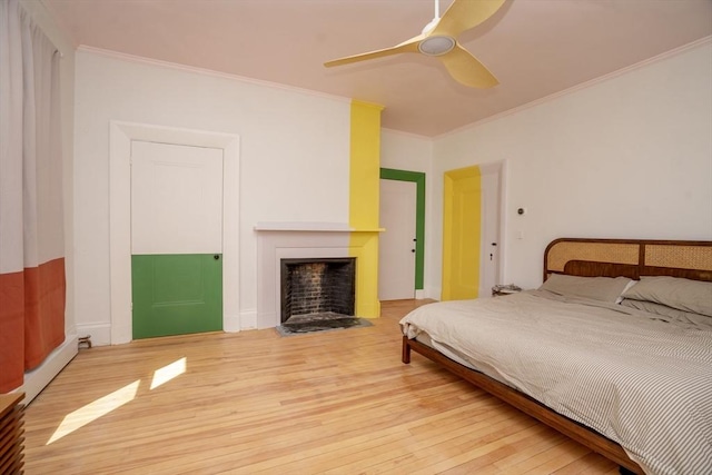 15 Estes, Amesbury, MA 01913 - bedroom with a fireplace with flush hearth, wood finished floors, a ceiling fan, and ornamental molding