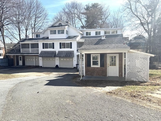13 Coombs St, Southbridge, MA 01550 - shingle-style home with a garage, aphalt driveway, and a shingled roof
