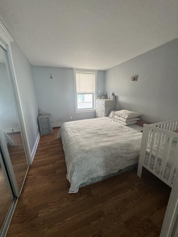 13 Coombs St, Southbridge, MA 01550 - bedroom featuring dark wood-type flooring and baseboards