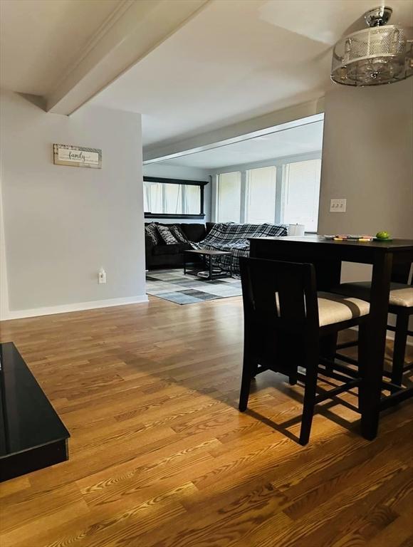 13 Coombs St, Southbridge, MA 01550 - dining area featuring baseboards, wood finished floors, and beamed ceiling