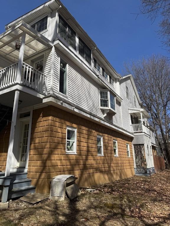 13 Coombs St, Southbridge, MA 01550 - view of property exterior with a balcony and entry steps
