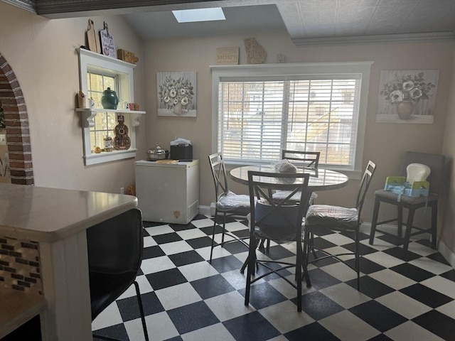 13 Coombs St, Southbridge, MA 01550 - dining space with tile patterned floors, a skylight, and baseboards