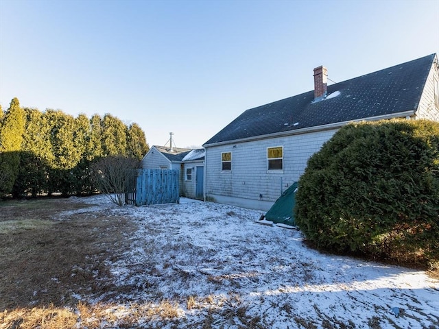 view of snow covered house