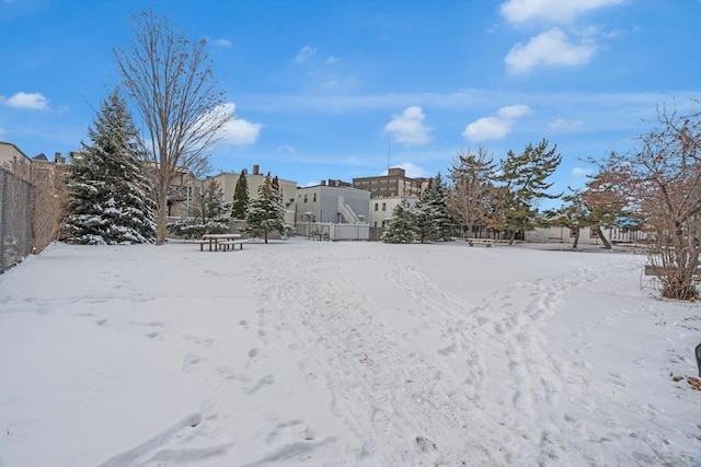 view of yard layered in snow