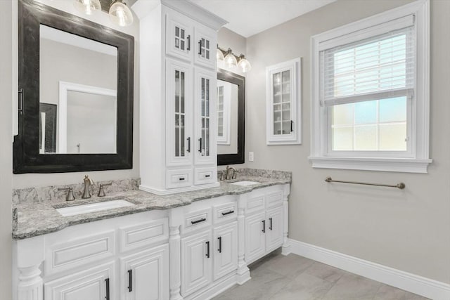 8 Fitch Farm Way, Southampton, MA 01073 - full bathroom featuring baseboards, double vanity, and marble look tile flooring