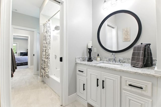 8 Fitch Farm Way, Southampton, MA 01073 - bathroom with marble finish flooring, vanity, shower / tub combo with curtain, baseboards, and connected bathroom