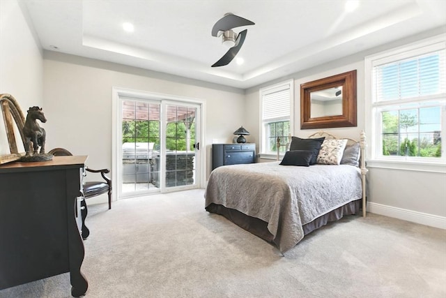 8 Fitch Farm Way, Southampton, MA 01073 - bedroom featuring a tray ceiling, access to exterior, multiple windows, light carpet, and recessed lighting