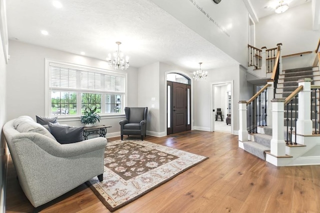8 Fitch Farm Way, Southampton, MA 01073 - living area with a chandelier, stairway, wood finished floors, baseboards, and recessed lighting