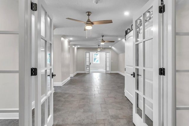 8 Fitch Farm Way, Southampton, MA 01073 - foyer featuring french doors, baseboards, a ceiling fan, stone finish flooring, and vaulted ceiling