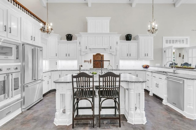 8 Fitch Farm Way, Southampton, MA 01073 - kitchen with appliances with stainless steel finishes, a chandelier, a sink, a high ceiling, and beam ceiling