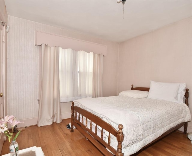 bedroom with wood-type flooring