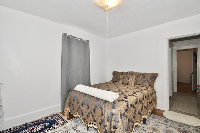 bedroom with wood finished floors