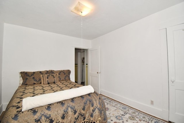 bedroom featuring baseboards
