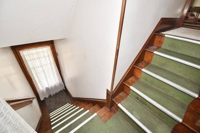 staircase with baseboards