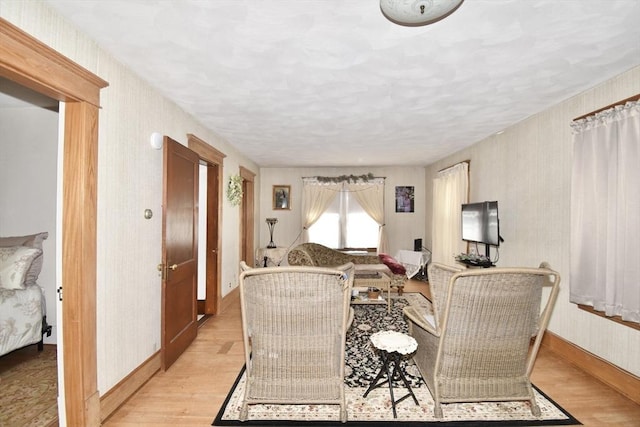 living room with light wood-style floors and baseboards